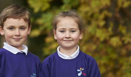 Two children smiling to camera