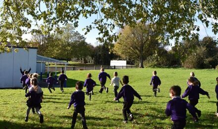 Children running across the field