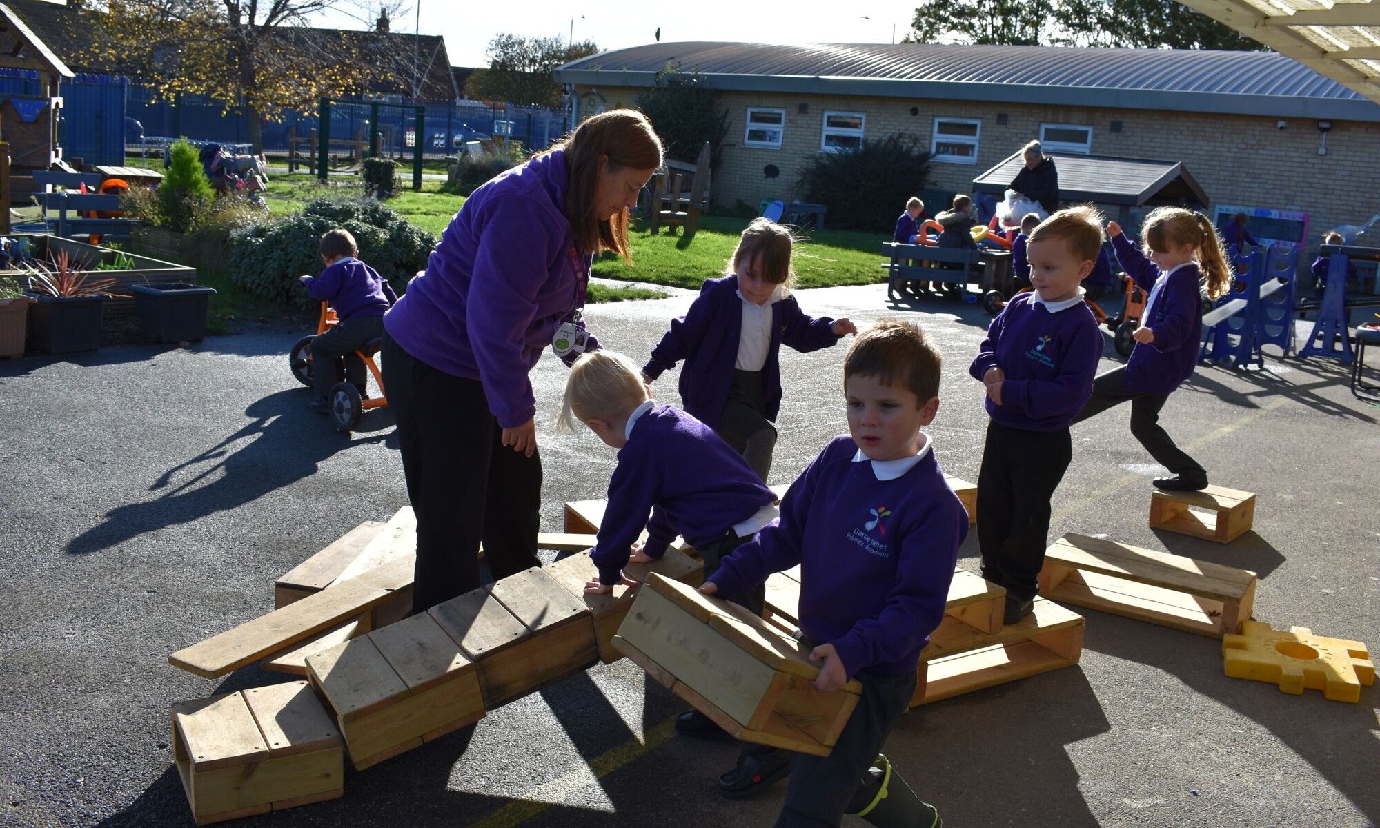 Children climbing in the outdoor learning environment